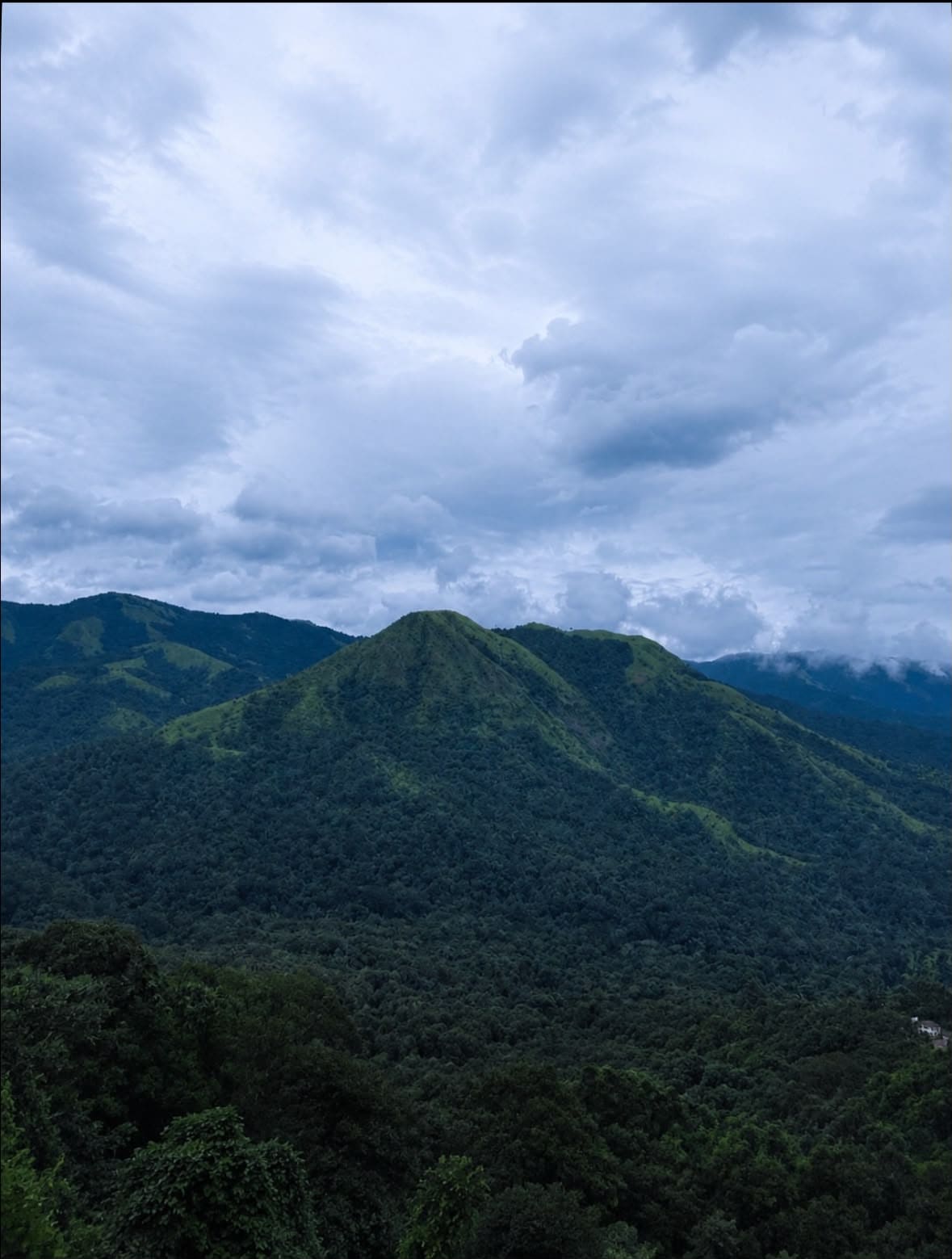 Panoramic view of cloud-covered hills and valleys