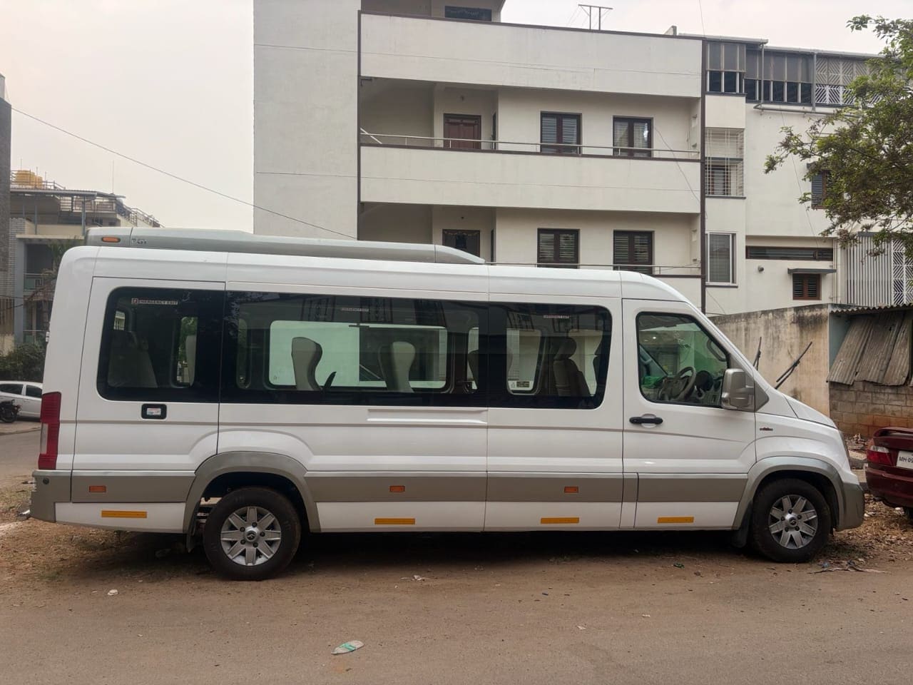 Tempo Traveller parked and ready for a group departure
