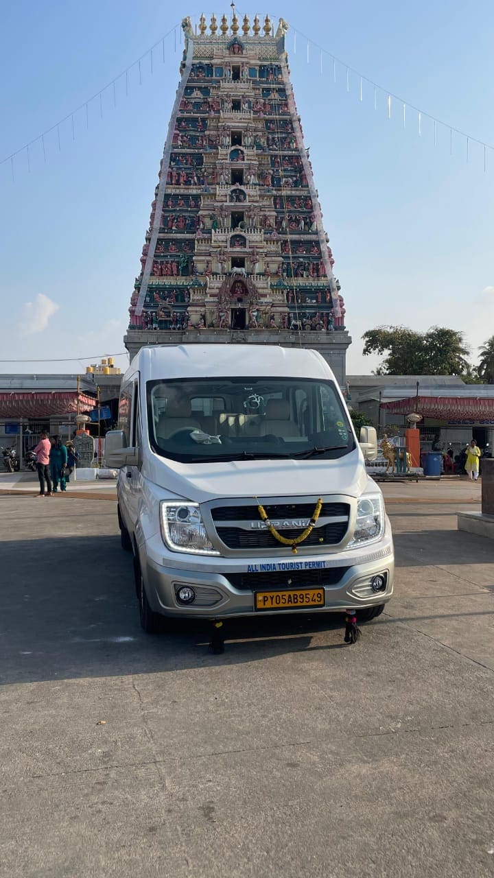 Tour vehicle decorated and parked outside Tirupati temple