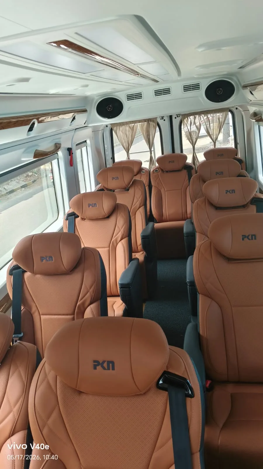 Tan leather luxury captain seating for group outstation travel from Bangalore